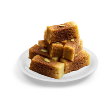 Load image into Gallery viewer, Stack of Milk cakes with nuts on a white plate