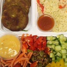 Load image into Gallery viewer, Hara bara kebab garden salad with rice from Tiffin Stash - Veg Healthy Meals by India&#39;s Flavour with colorful veggies and sauces.
