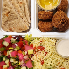 Load image into Gallery viewer, Mediterranean falafel rice bowl from Tiffin Stash - Veg Healthy Meals by India&#39;s Flavour with pita, salad, and tahini sauce.
