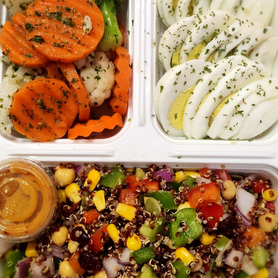 Hard boiled eggs with quinoa salad and mixed vegetables from Tiffin Stash - Non-Veg Healthy Meals by India's Flavour, ideal for protein-rich clean eating.